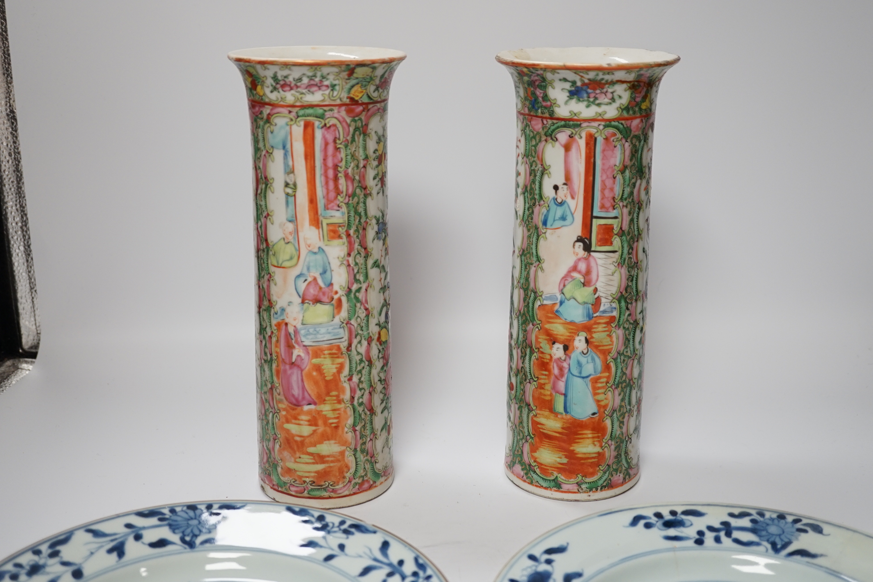 A pair of 19th century Chinese famille rose sleeve vases and a pair of 18th century Chinese blue and white plates, vases 26.5cm